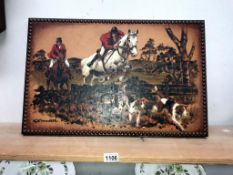 An embossed painting on leather of a hunting scene,