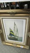 A gilt framed print of a sailing boat.