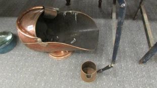 A copper coal scuttle and a copper jug.