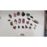 A good collection of agate and other stone pendants and other stones.