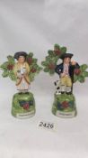 A pair of Staffordshire shepherd and shepherdess figures.