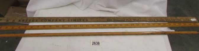 Three yard sticks including an advertising example.