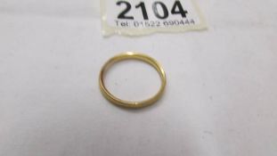 A 22ct gold wedding ring, size O half, 2.9 grams.