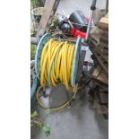 A garden hose on reel.