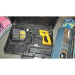 A cased Dewalt drill.