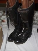 A pair of vintage riding boots