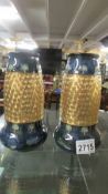 A pair of Doulton Lambeth vases, 20cm tall, in very good condition.