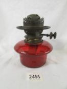 A genuine ruby glass drop in oil lamp font with original Hinks burner, in good condition.