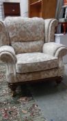 A comfortable arm chair with removable covers and brass castors, very clean. (Collect only).