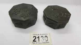 Two early bronze trinket/snuff boxes.