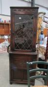 A lead glazed corner cabinet.