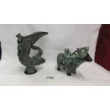 A Chinese Bronzed verdigree effect spelter lidded goat and a similar jug.