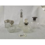 4 scent bottles with silver collars and a hair pot with silver top.