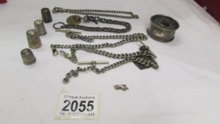 Three old watch chains, a silver thimble a/f, three other thimbles etc.