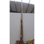 A quantity of snooker cue's and rests.