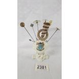 A shell shaped crested hat pin stand 'Reading' with 10 hat pins.