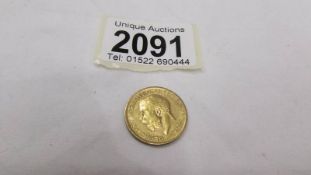 A 1911 gold sovereign. ****Condition report**** Lettering on Sovereign is either E.