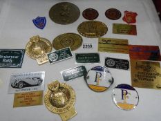 A collection of classic car rally plaques and badges including Lincoln, Newark, Derby etc.