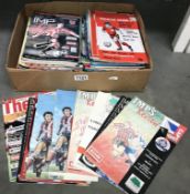 A collection of football programmes,