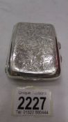 A good quality chased silver cigarette case.