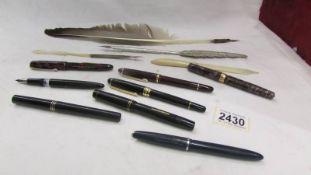 3 old dip pens, a letter opener and 8 fountain pens (one missing cap).