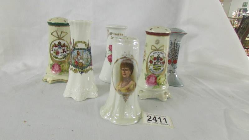 Five souvenir hat pin stands and a commemorative hat pin stand 'Queen Mary'.