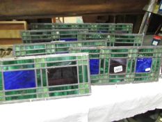 Six panels of leaded stained glass,