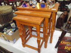 A golden oak nest of tables