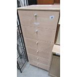 A tall six drawer chest.