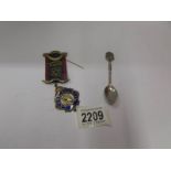 A hall marked silver RAOB medal and a silver spoon.