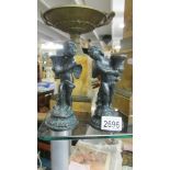 A pair of early 20th century spelter angel candlesticks.