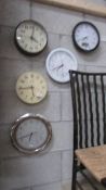 Five wall clocks including a radio controlled example.
