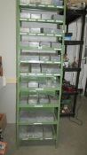A green metal shelf unit with 40 boxes of assorted screws, nails etc.