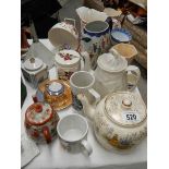 A mixed lot of china teapots etc.