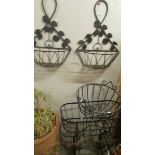 Three wrought iron garden baskets and 2 wall hanging baskets.