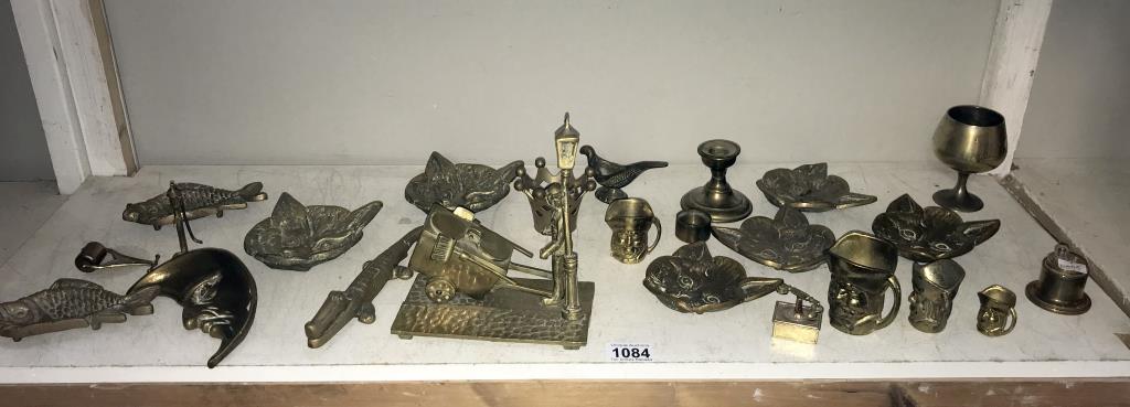 A selection of brassware including cat head, dishes & crocodile nut cracker etc.