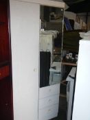 A white melamine wardrobe.