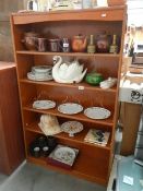 A teak book case.