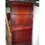 A mahogany book case.