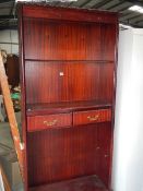 A mahogany book case.