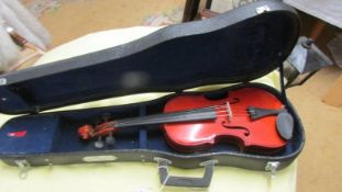 A small cased violin.