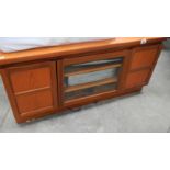 A good teak TV stand and a video.