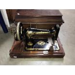 A cased Singer sewing machine (Collect only)