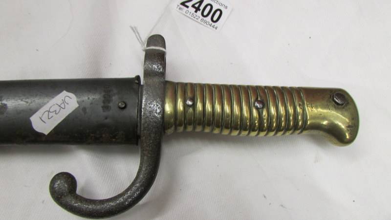 An old bayonet with brass hilt, No. S29940. - Image 2 of 3