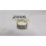 A 14ct gold three stone diamond ring, (1 carat diamonds in total,