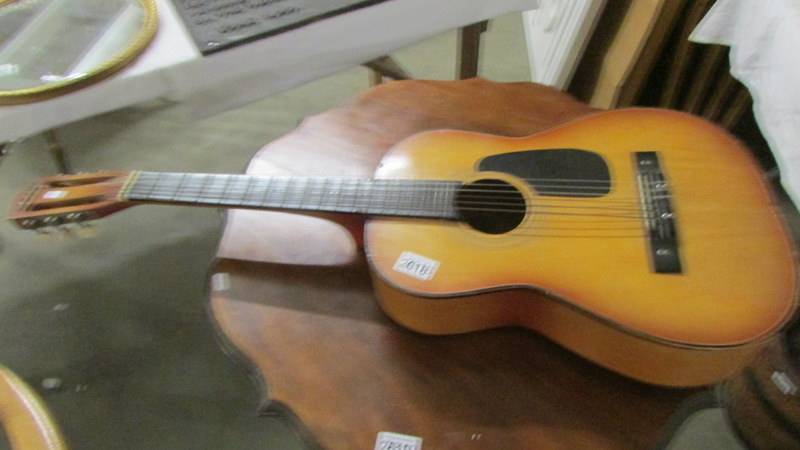 An acoustic guitar,