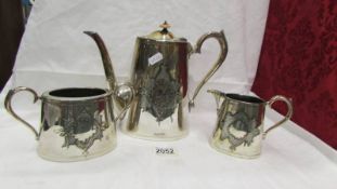 A three piece silver plate tea set.