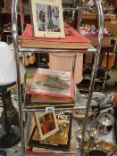 Three shelves of art related books.