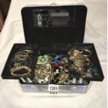 A silver jewellery box with an assortment of costume jewellery