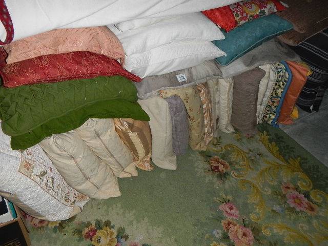 Approximately 28 clean cushions.